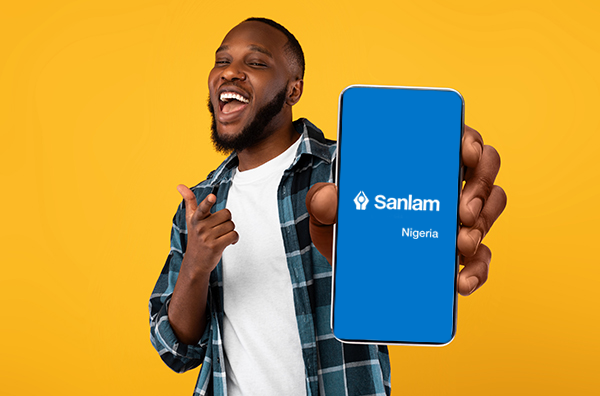 Smiling Guy with phone showing Sanlam Nigeria Mobile App
